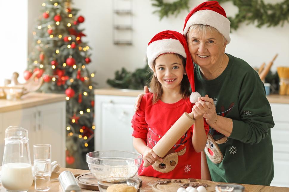 Vintage style photograph of a grandmother and grandchild baking together, with a corn casserole in the background
