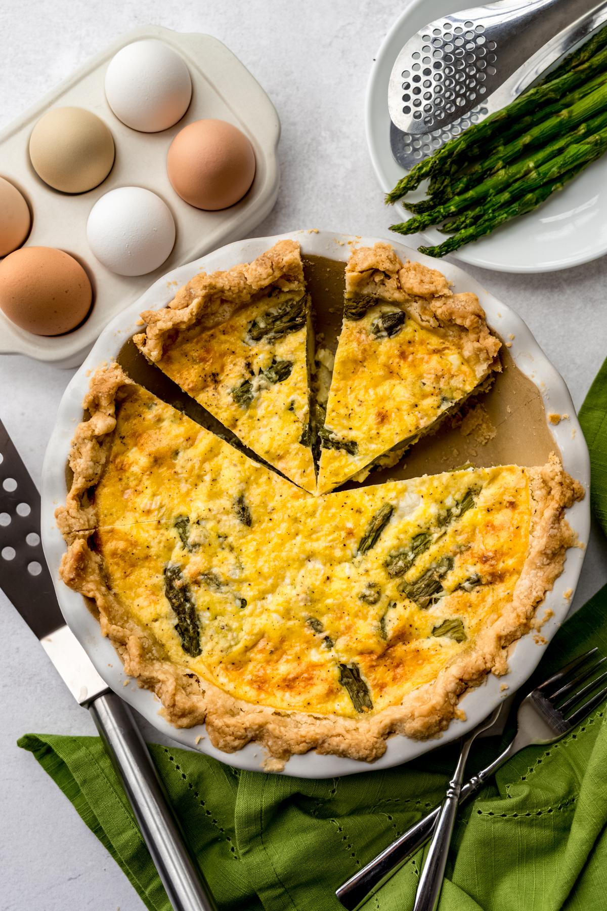 Slice of Boiled Egg and Asparagus Quiche on a plate
