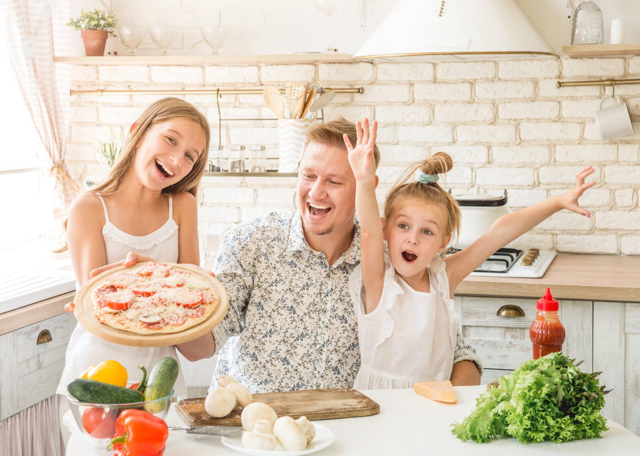 serving homemade pizza with family and friends