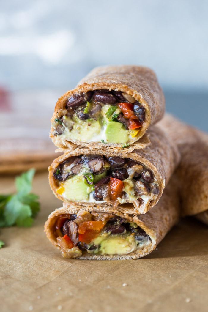 injera wraps with avocado, black beans, and fresh vegetables