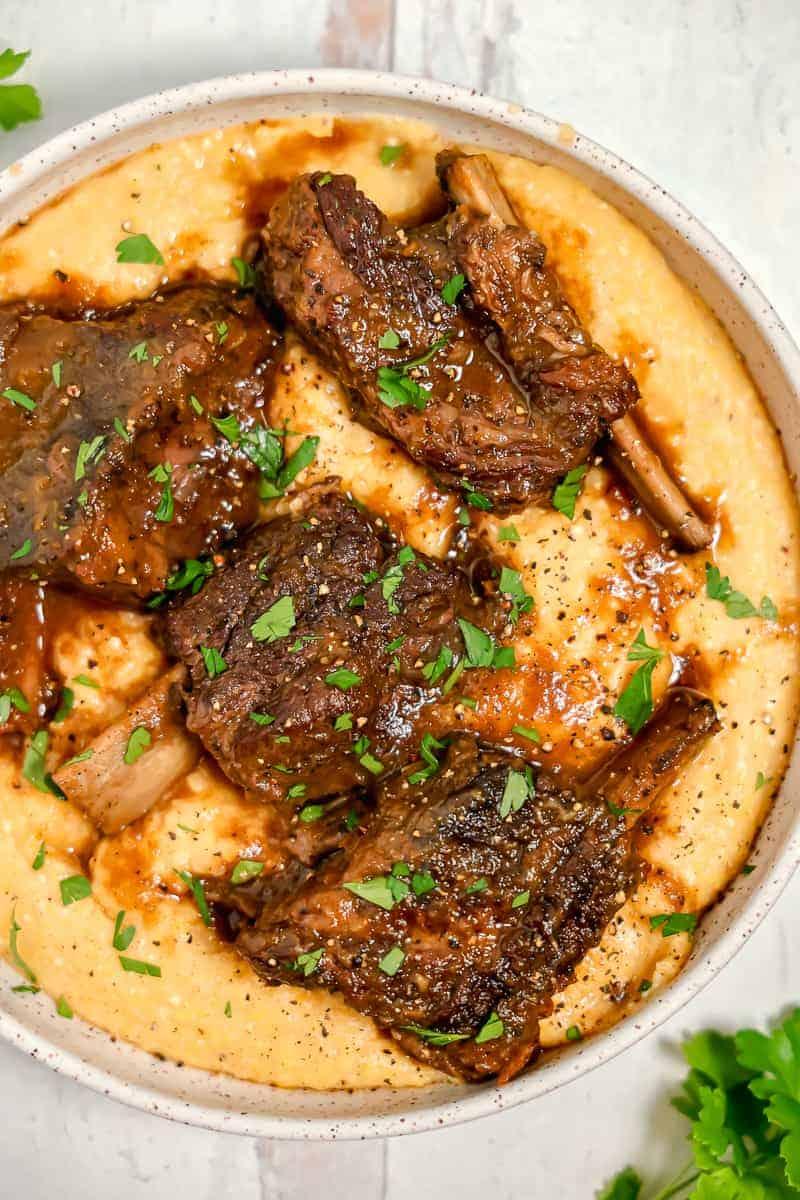 slow cooker beef short ribs served over creamy polenta