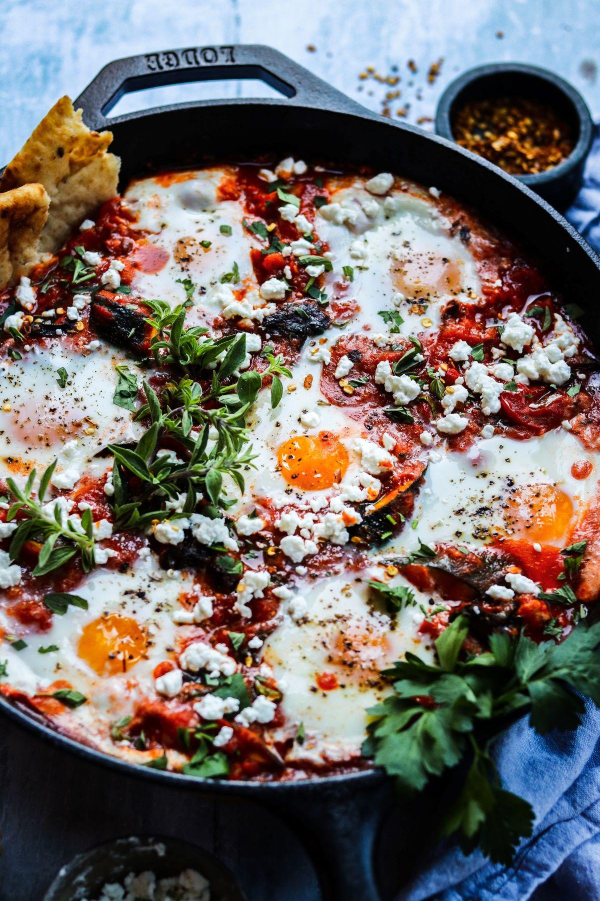 Close-up of the feta cheese and fresh mint on top of the shakshuka