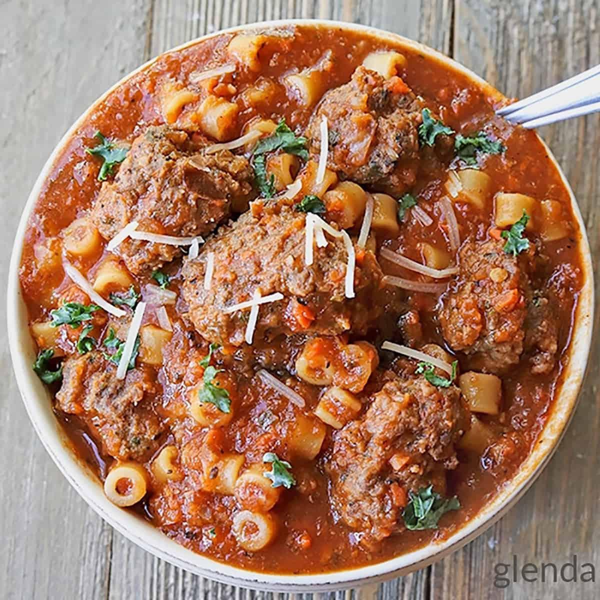 bowl of melted snowball meatball stew with crusty bread