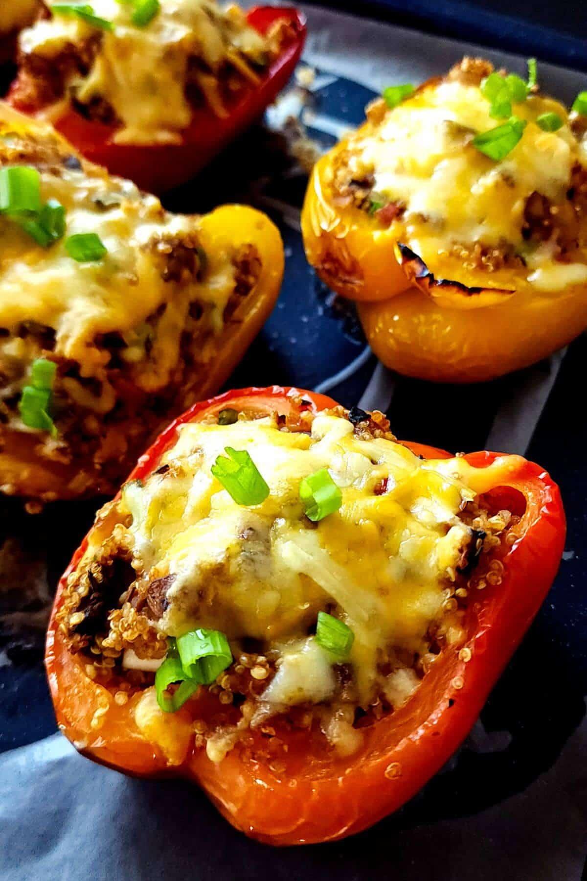 Close-up of steamed bell peppers stuffed with mushrooms, showcasing the texture and vibrant colors of the dish