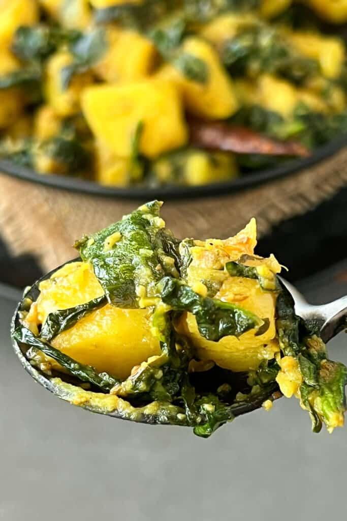 Aloo Palak Pizza with vibrant green spinach and golden potatoes