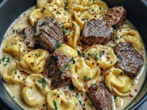 Full shot of the garlic steak and cheese tortellini skillet, ready to serve