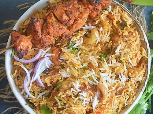 Close-up shot of Chicken Tikka Biryani, showcasing the layers of rice and chicken