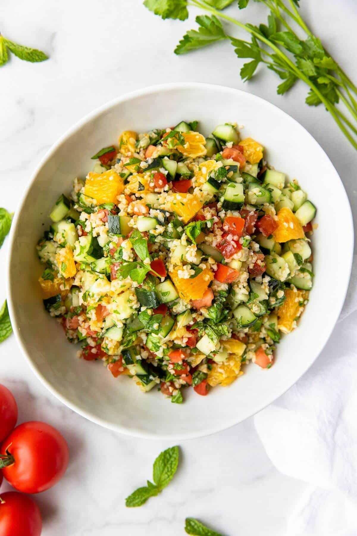 overhead shot of a bowl of orange-infused tabbouleh salad