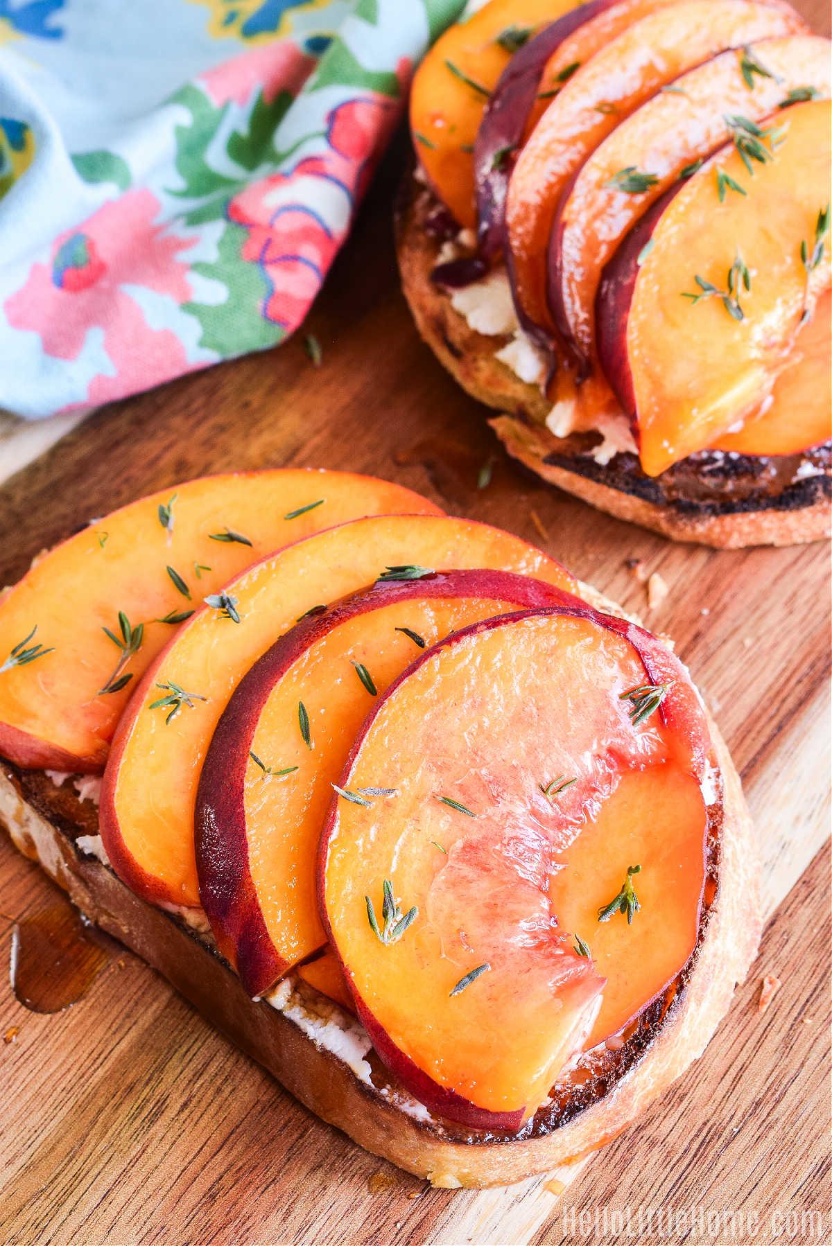 A slice of toast with rosemary peach preserves spread on it