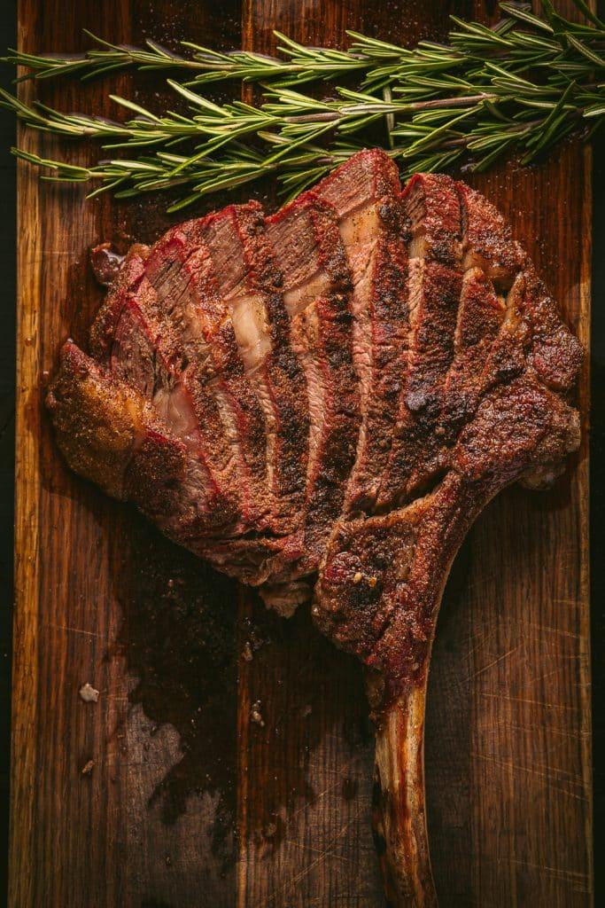 Close up of a perfectly seared tomahawk steak