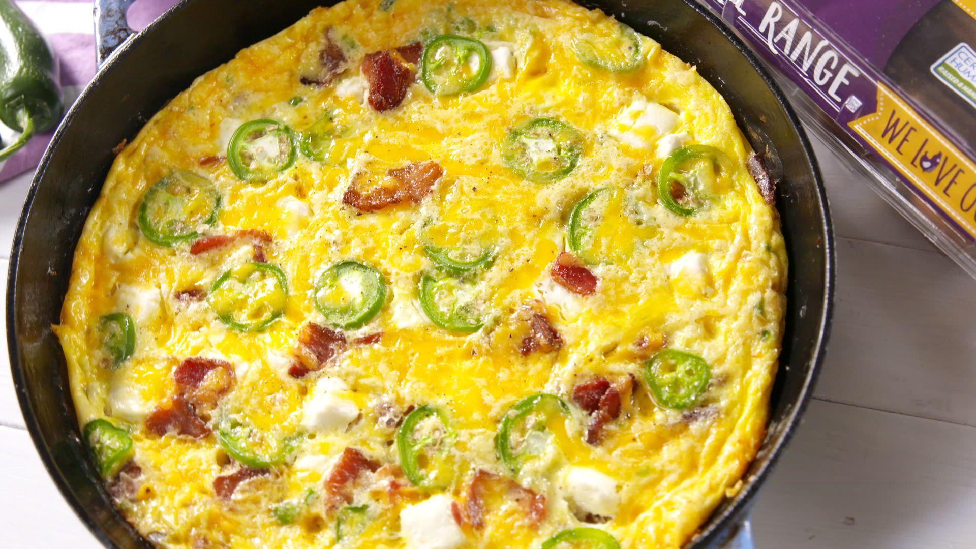 close up shot of a slice of Jalapeño Popper Frittata being lifted from a skillet