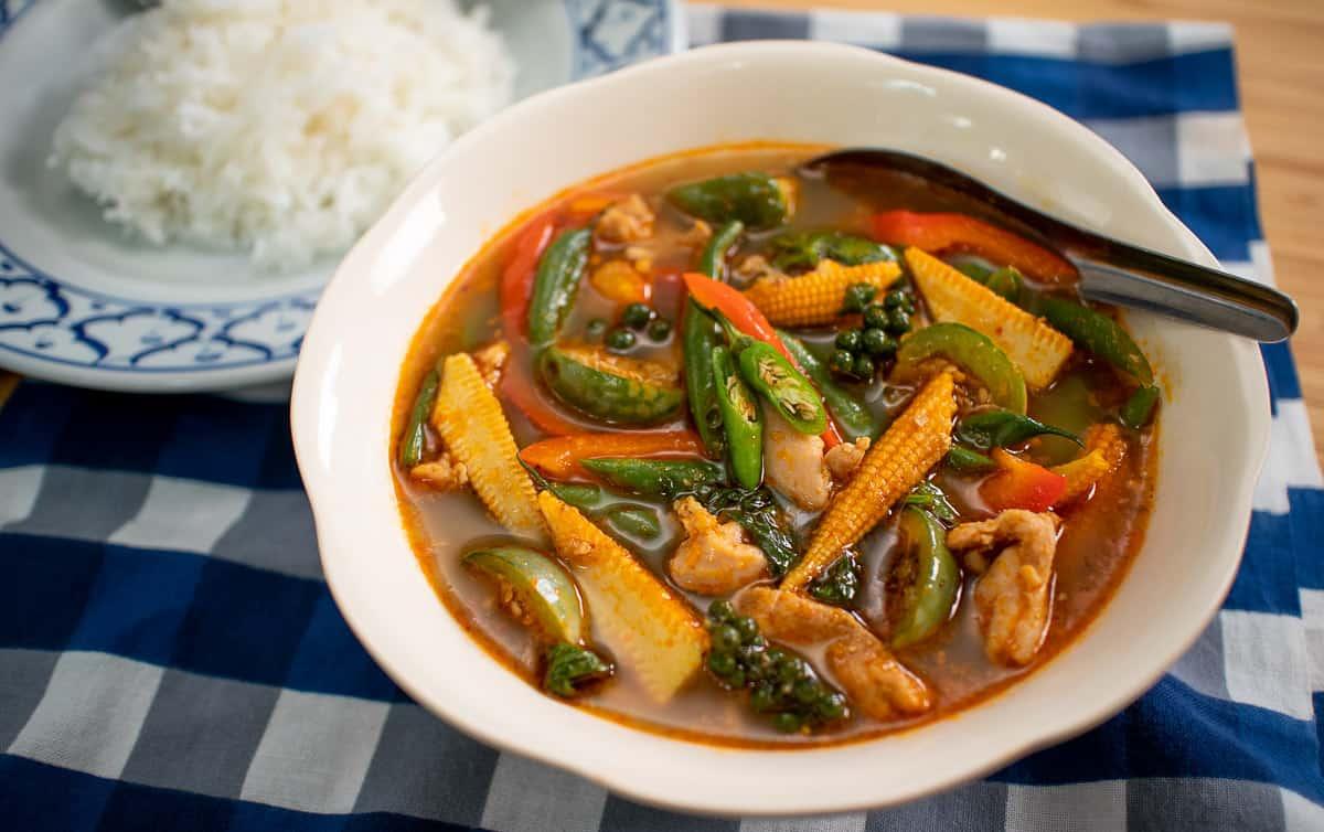 Jungle Curry Hot Pot with vibrant vegetables and steam rising