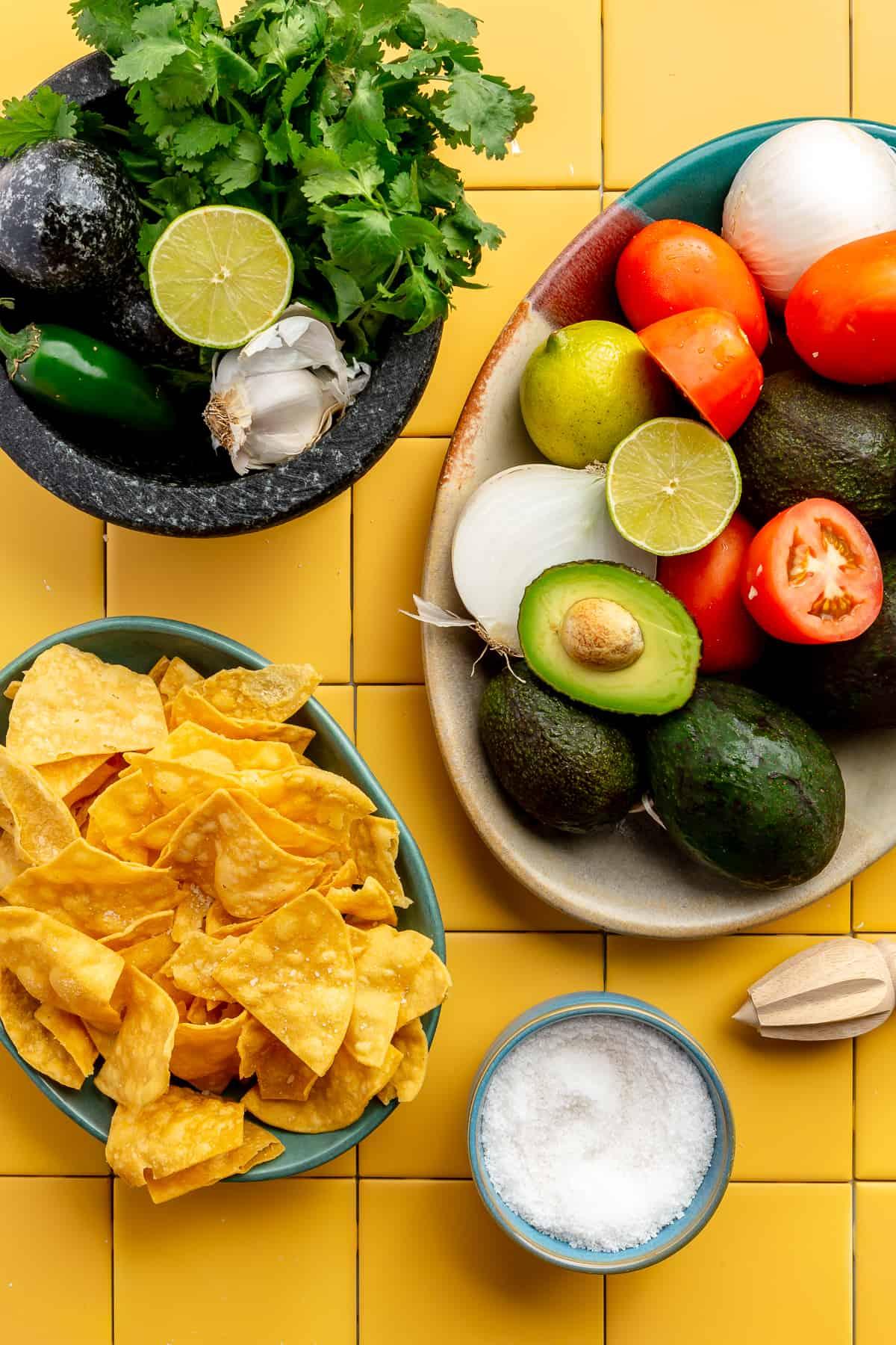 Ingredients for Sotol Guacamole laid out on a wooden table