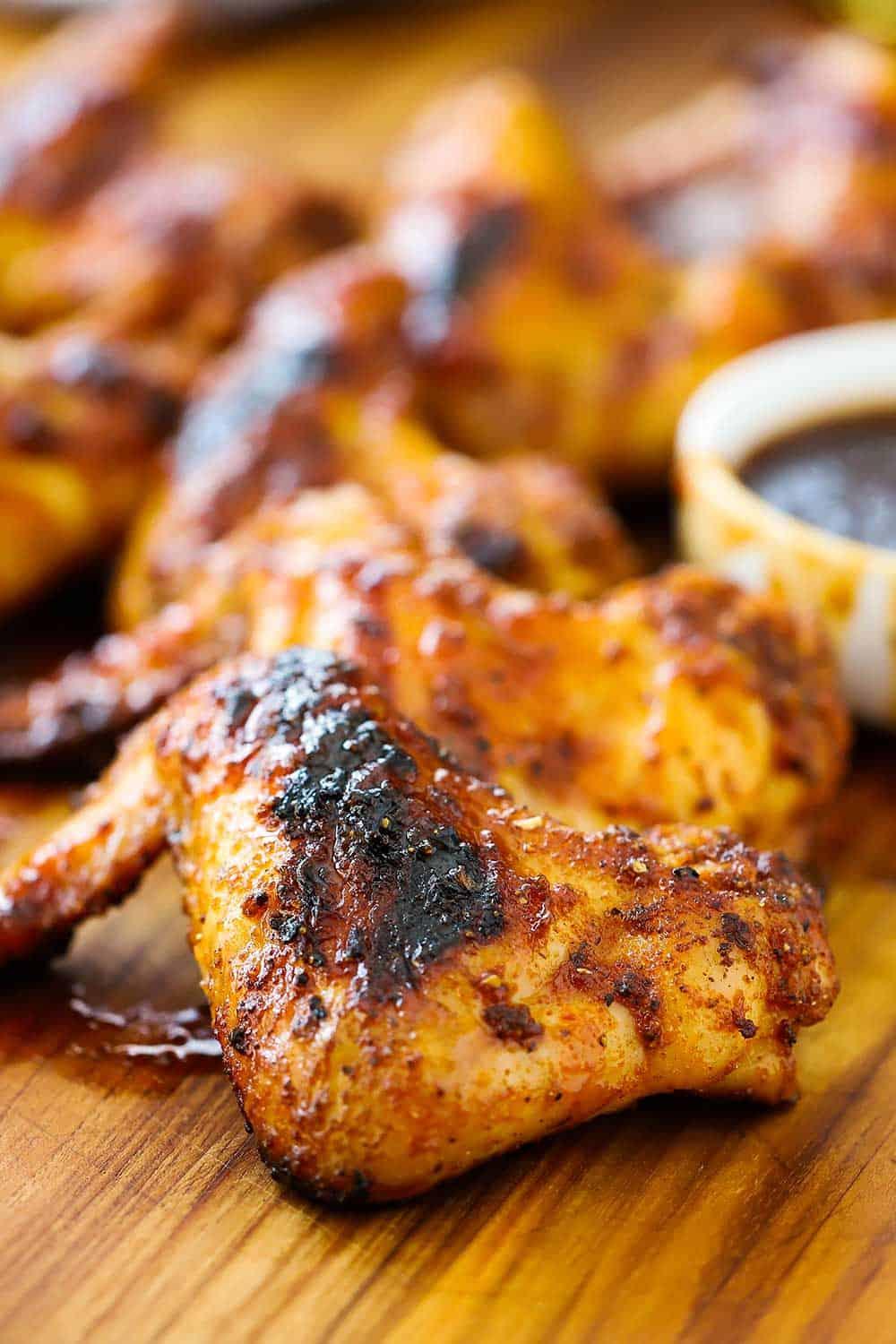 close up shot of bourbon bbq grilled chicken wings on a grill