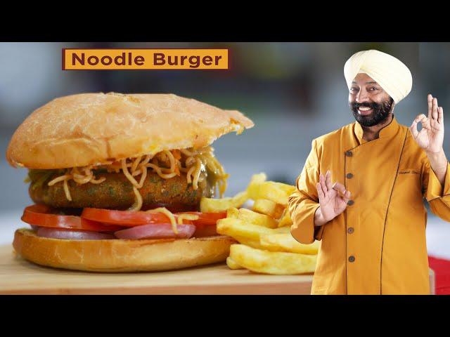 a chef carefully assembling a noodle burger in a bright, modern kitchen, with various toppings and sauces visible