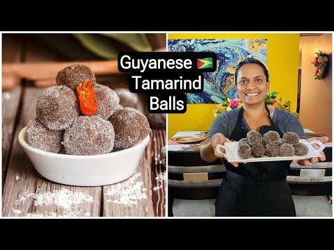 a person preparing tamarind balls in their kitchen