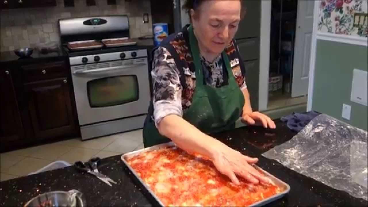 rustic italian grandma baking pizza