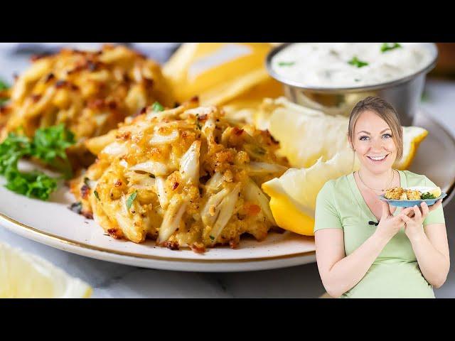 Person enjoying Maryland crab cakes