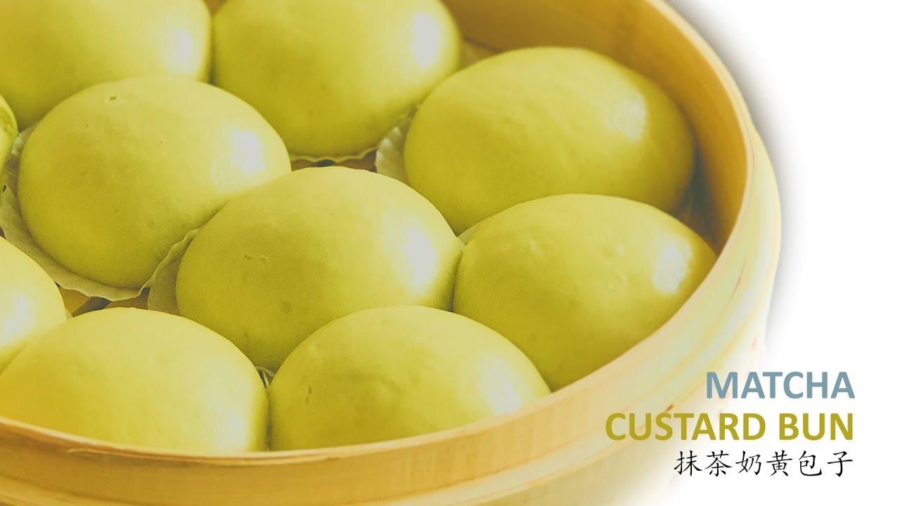 Matcha custard buns on a bamboo steamer