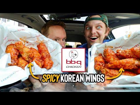 people eating spicy korean bbq chicken wings