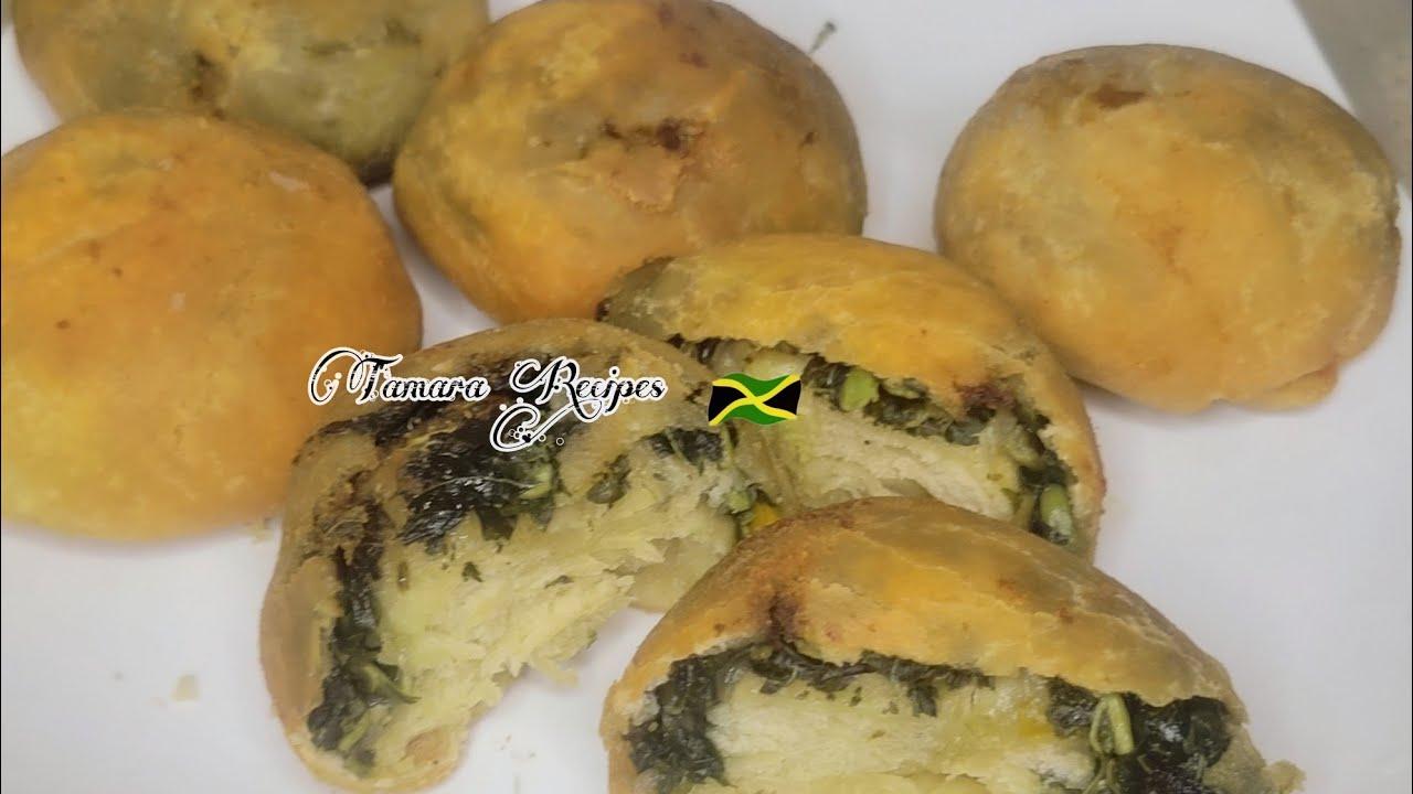 a variety of callaloo and crabmeat stuffed dumplings, some steamed, some fried