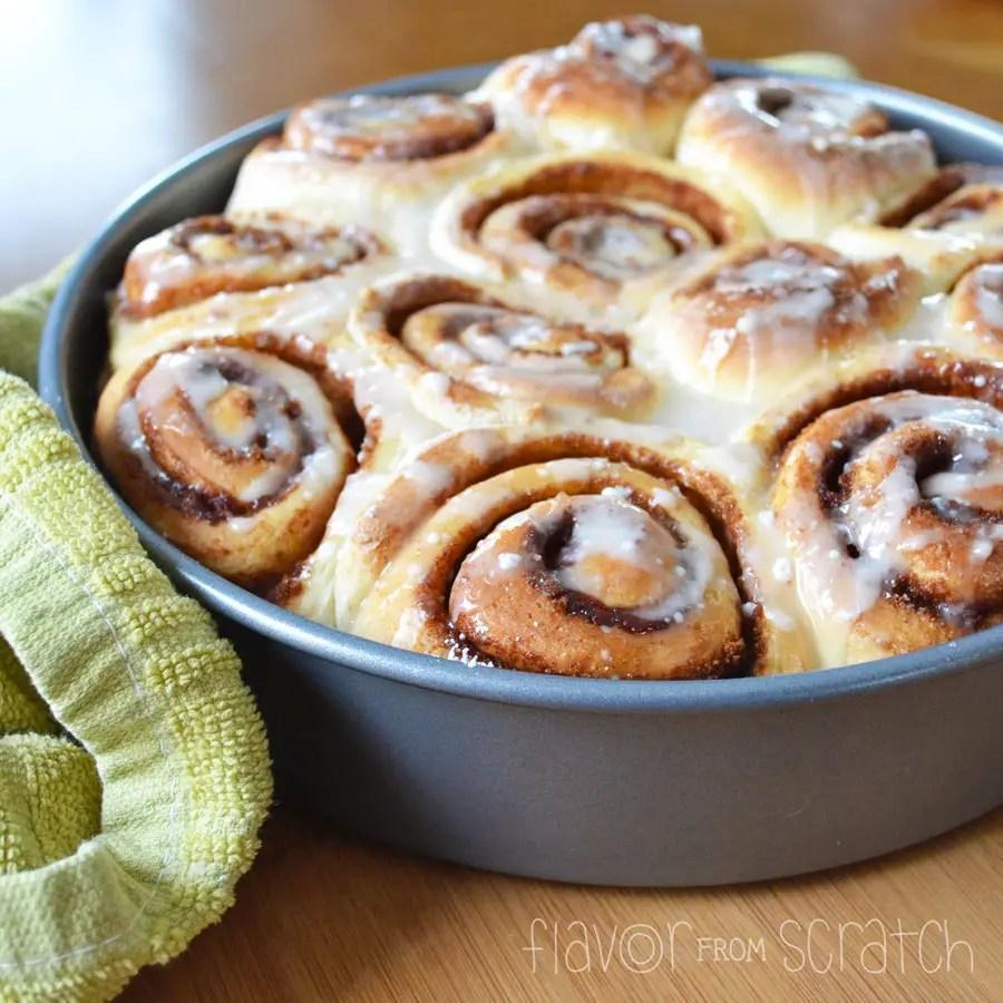 family enjoying cinnamon rolls on christmas morning