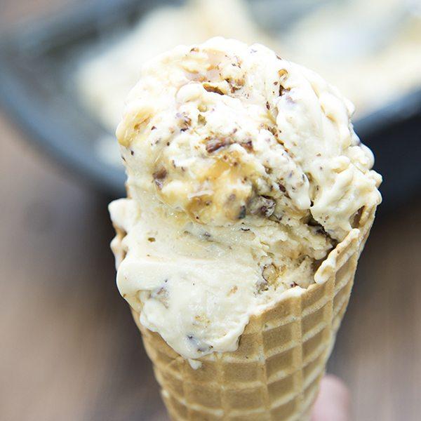 Close-up shot of pecan pie ice cream with caramel drizzle