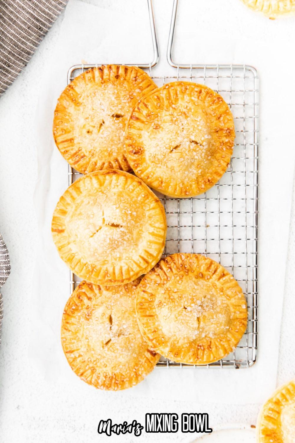 apple cinnamon hand pies cooling on wire rack