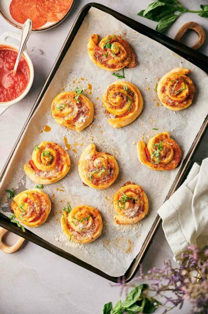 homemade pizza rolls on a baking sheet