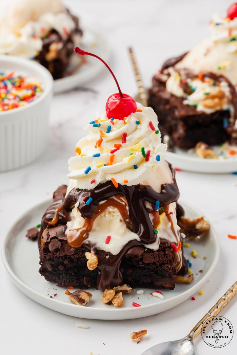 a brownie sundae with a scoop of ice cream and whipped cream