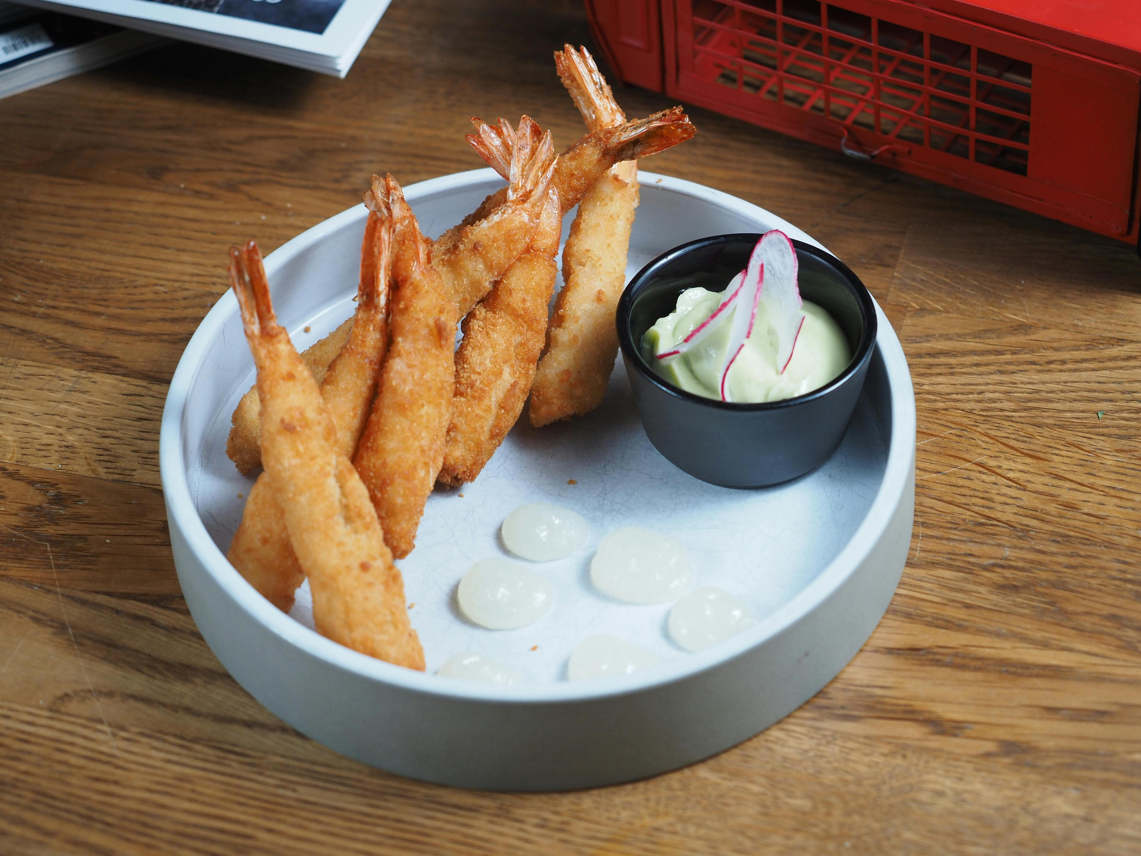 overhead shot of a table setting with cañihua tempura and dipping sauces