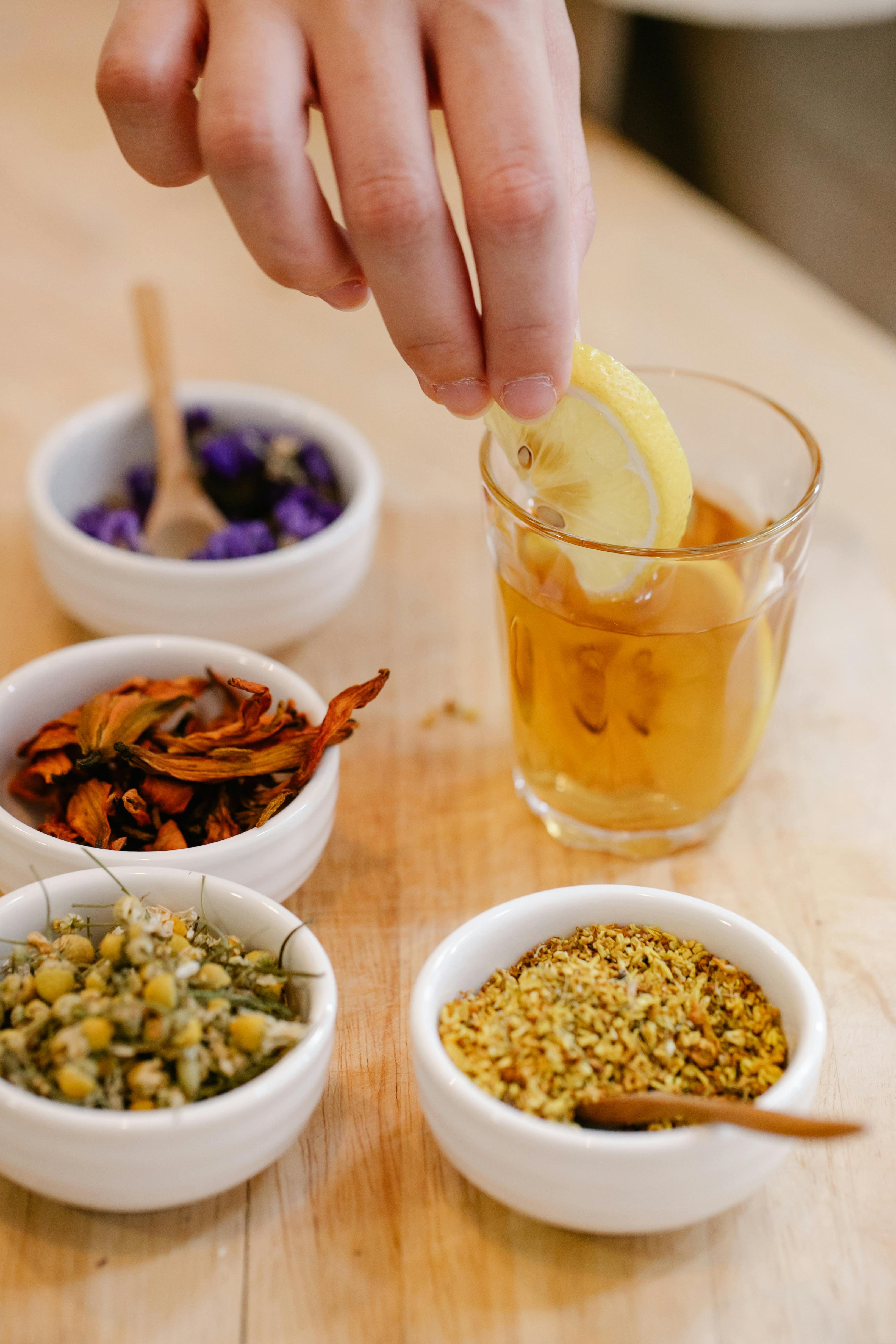 a close-up shot of lemon slices and herbs being mixed