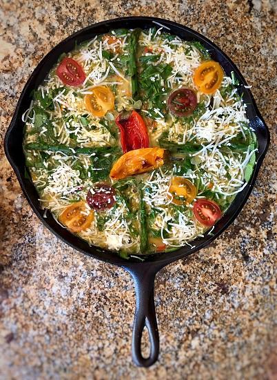close-up shot of a colorful zero-waste frittata in a cast-iron skillet