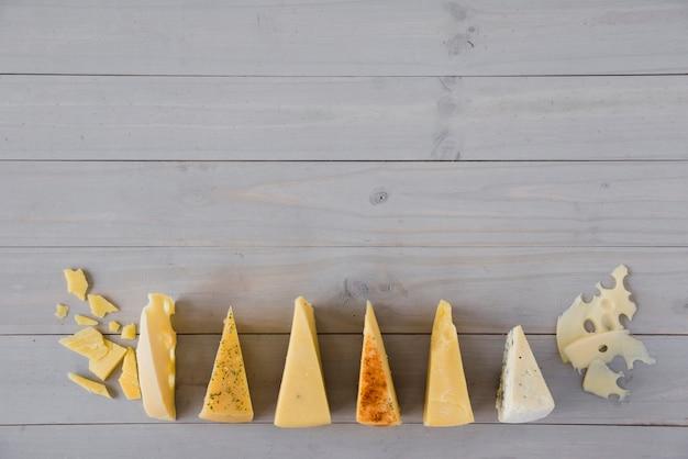 Close-up of five different cheeses arranged artfully