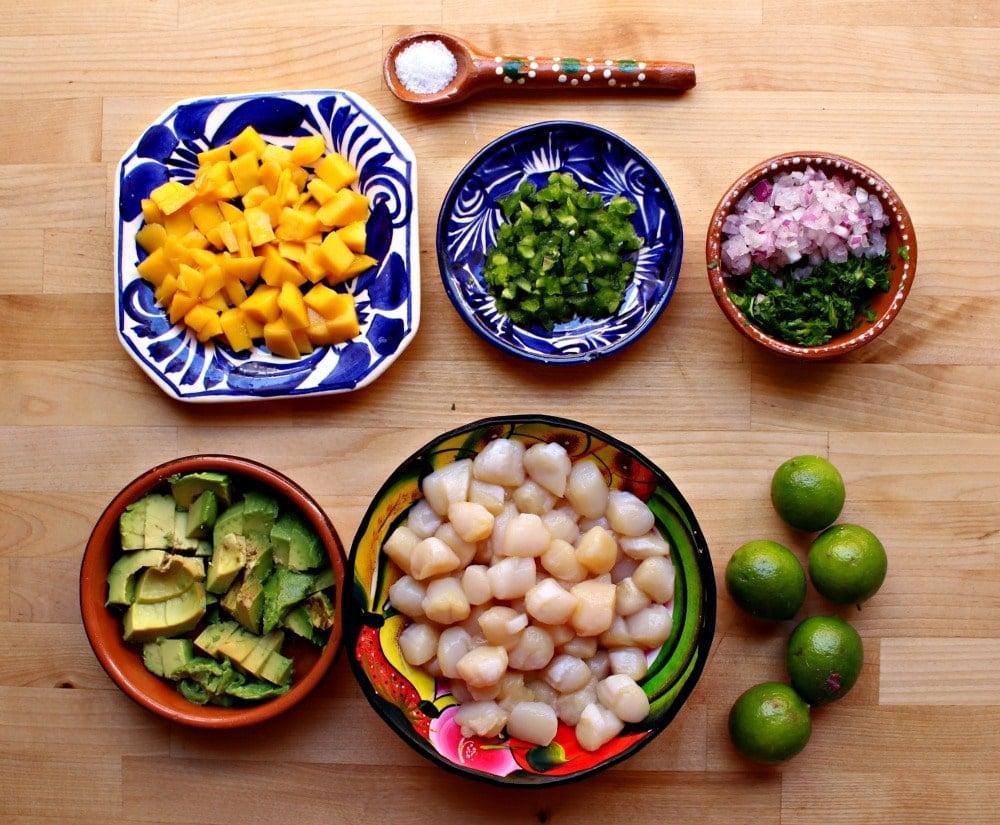 ingredients for ceviche laid out on a wooden table