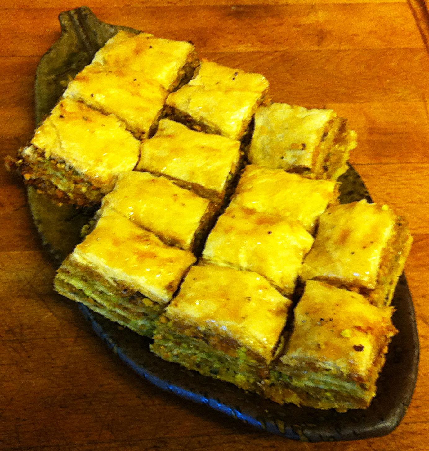 Apricot and clove walnut baklava cooling on a wire rack.