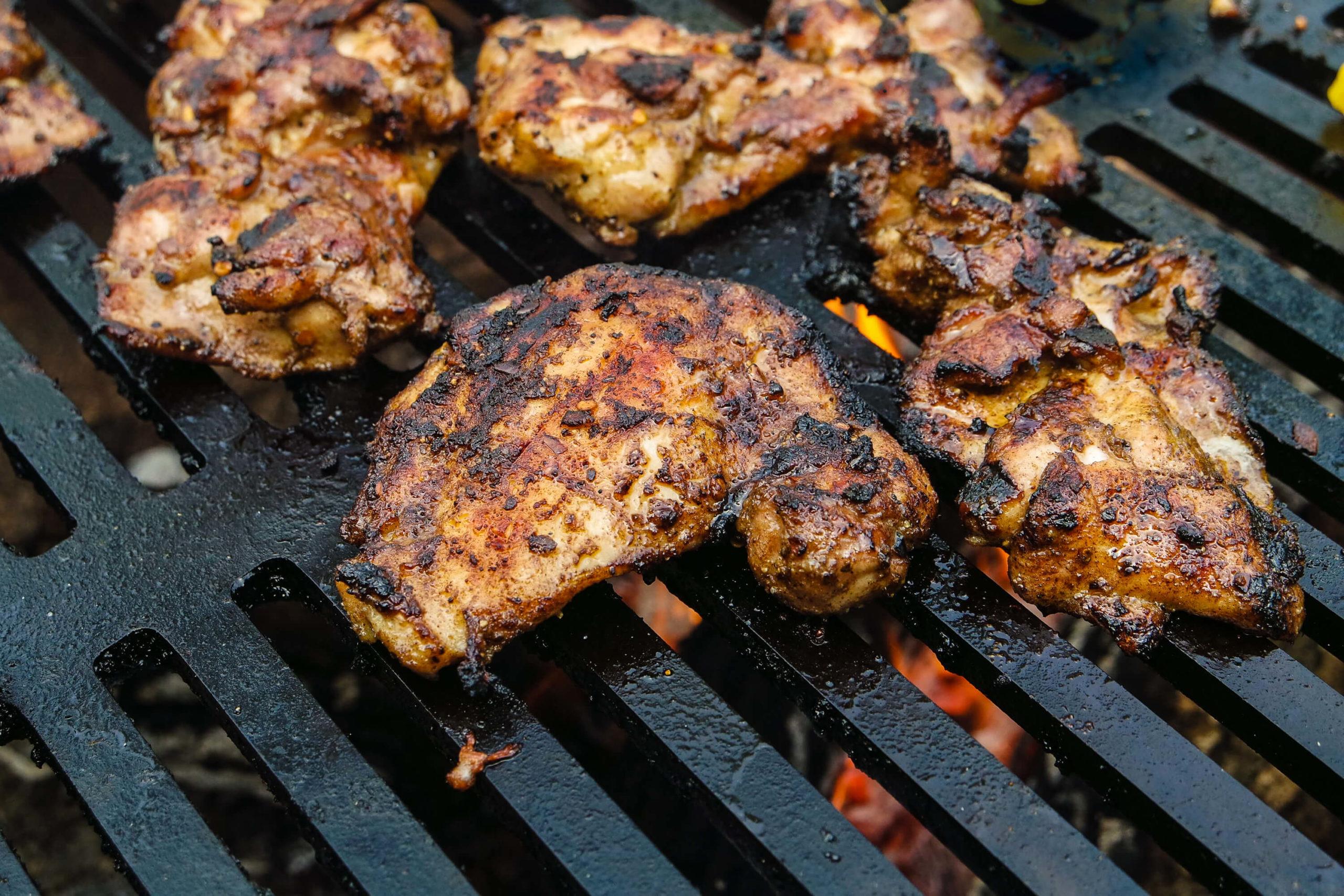 Jamaican jerk chicken on a grill