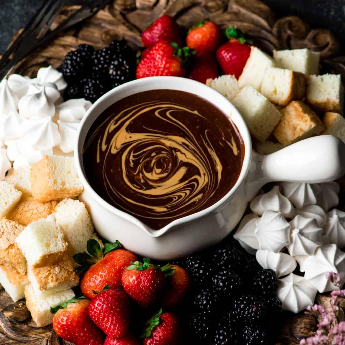 Warm peanut butter chocolate fondue with various dippers