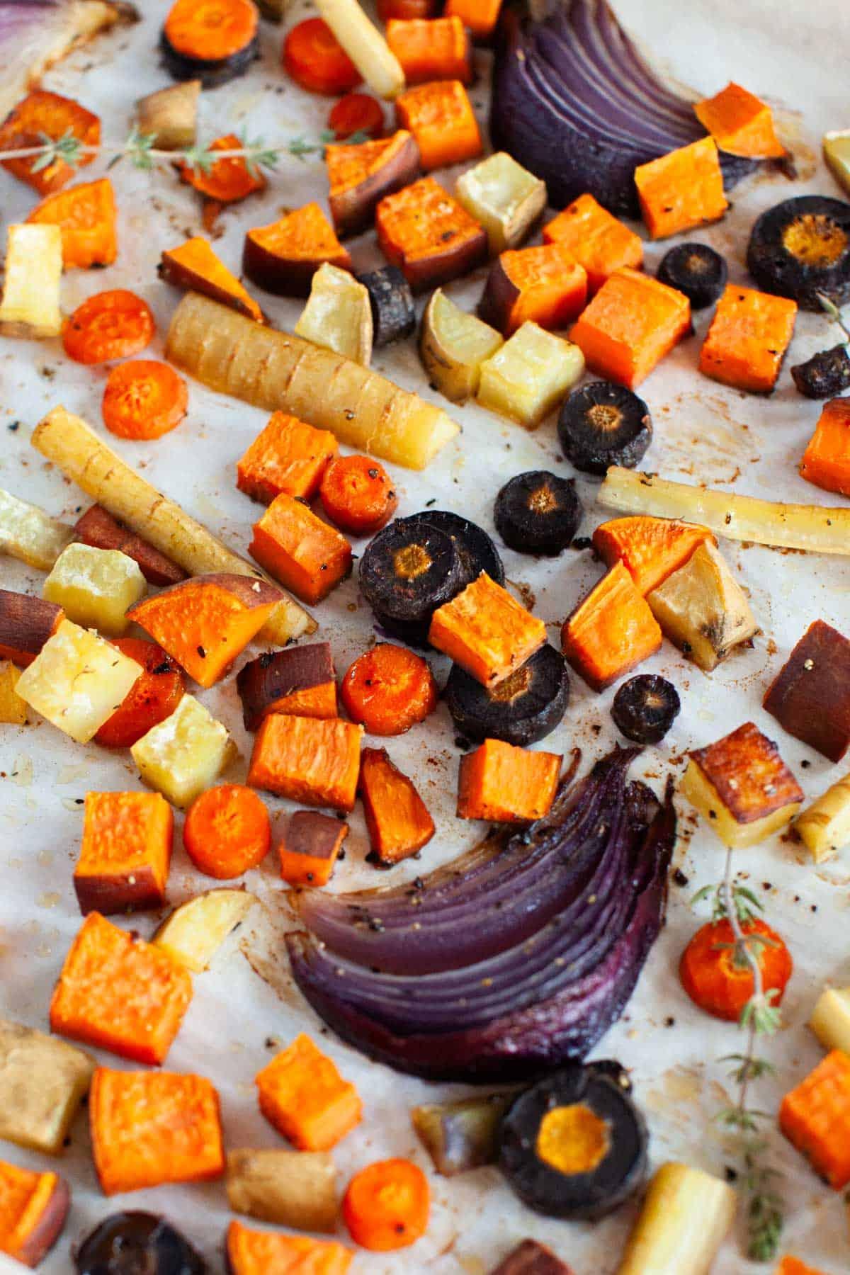 vibrant roasted root vegetables on a baking sheet