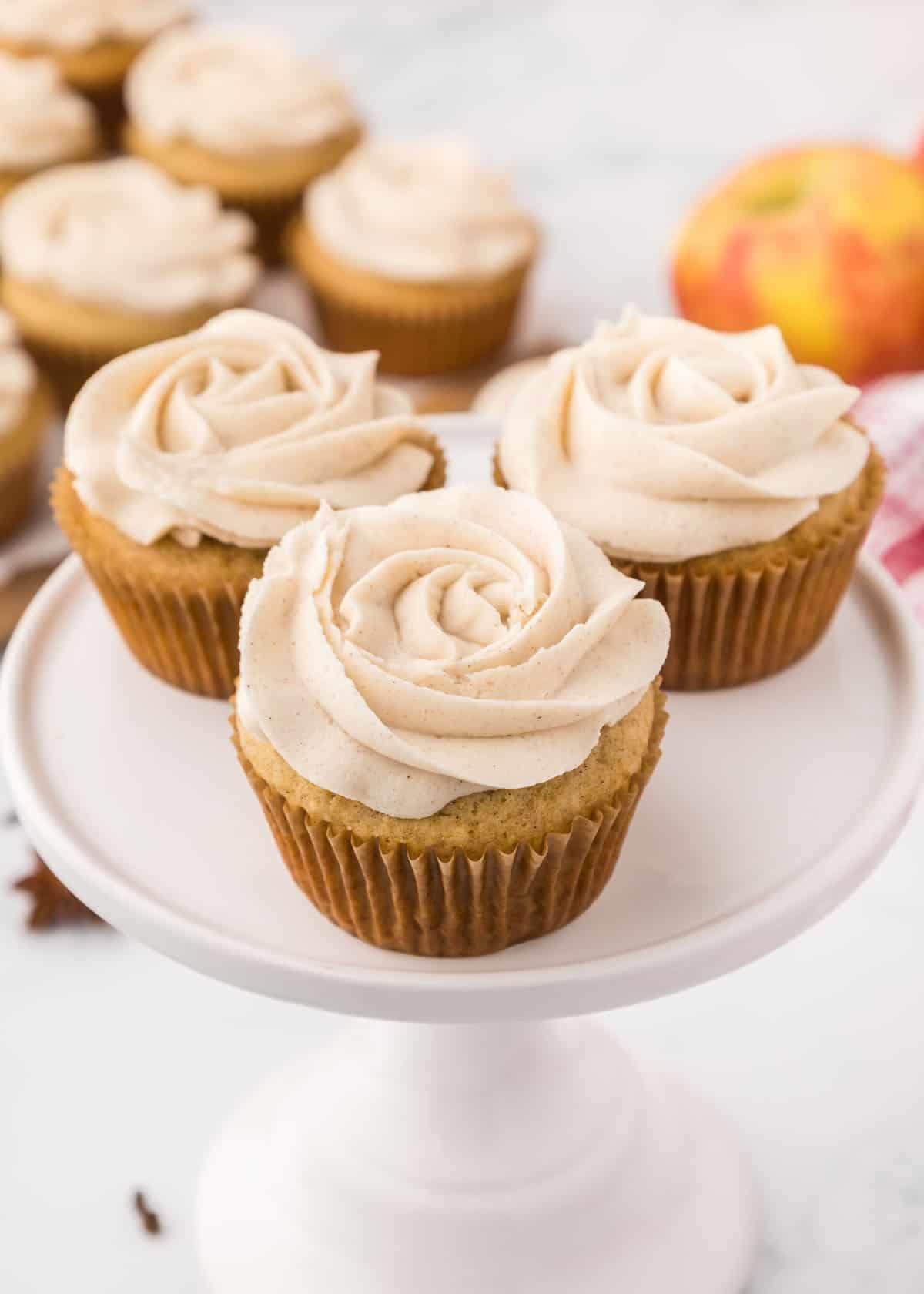 close-up shot of a single apple spice latte cupcake with frosting, showcasing the texture and spices