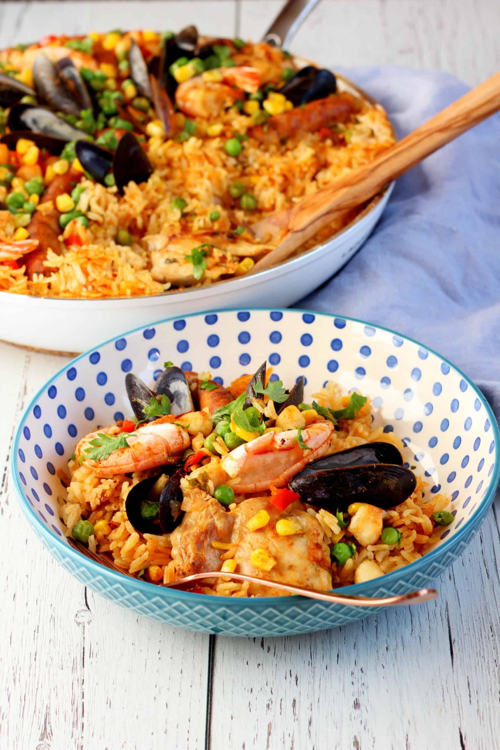 Saffron and Seafood Paella Risotto served on a rustic plate, garnished with fresh parsley