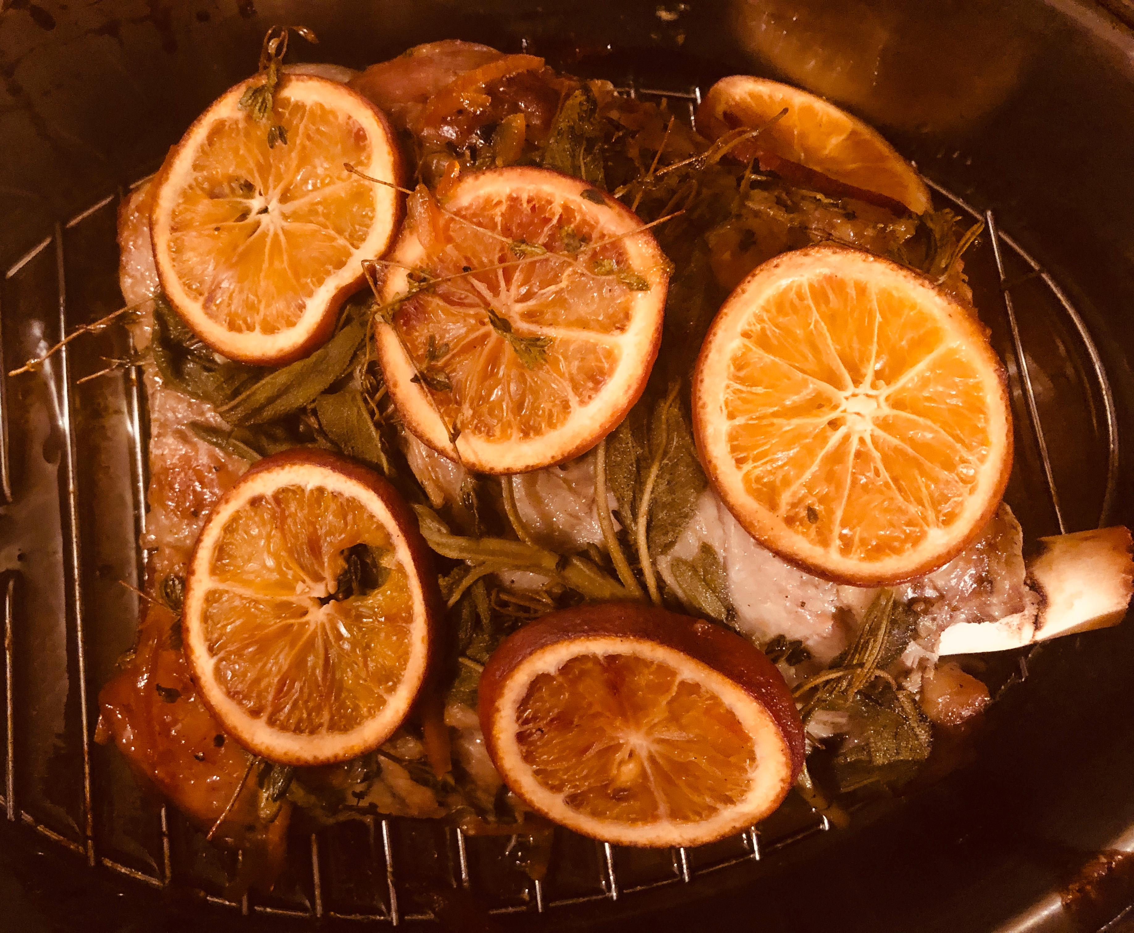 close up of lamb being marinated with blood orange juice