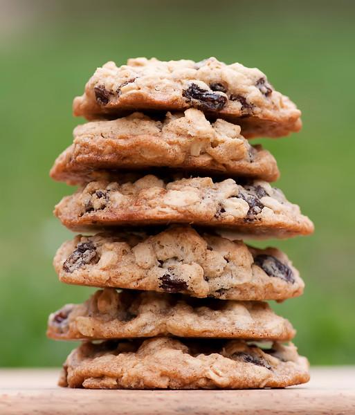 ingredients for oatmeal raisin cookies laid out on a wooden counter