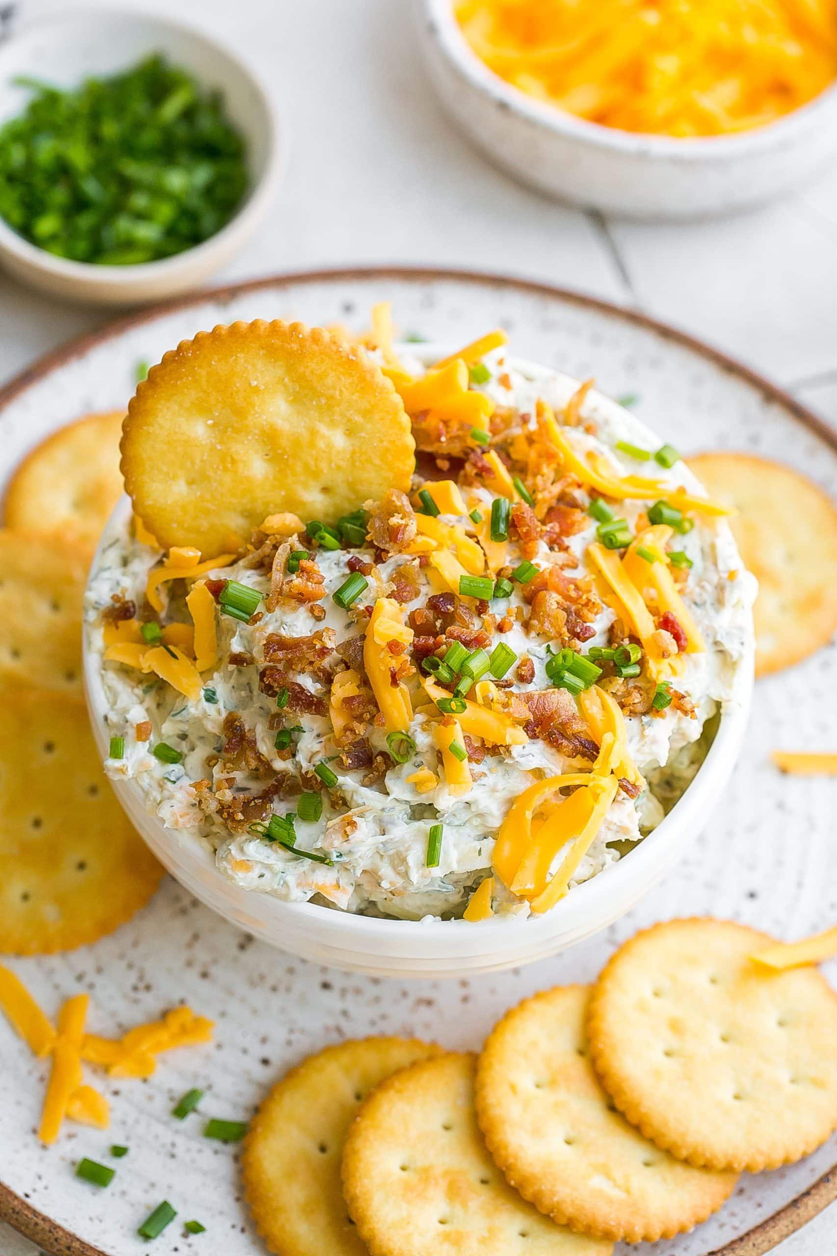 Close-up shot of creamy bacon and ranch dip with tortilla chips