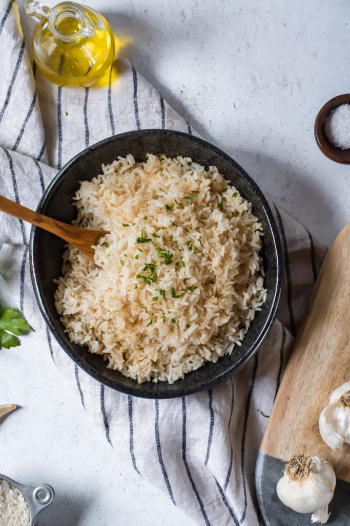 Close-up of Peruvian rice being fluffed with a fork