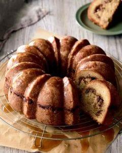 a full apple pecan coffee cake cooling on a wire rack