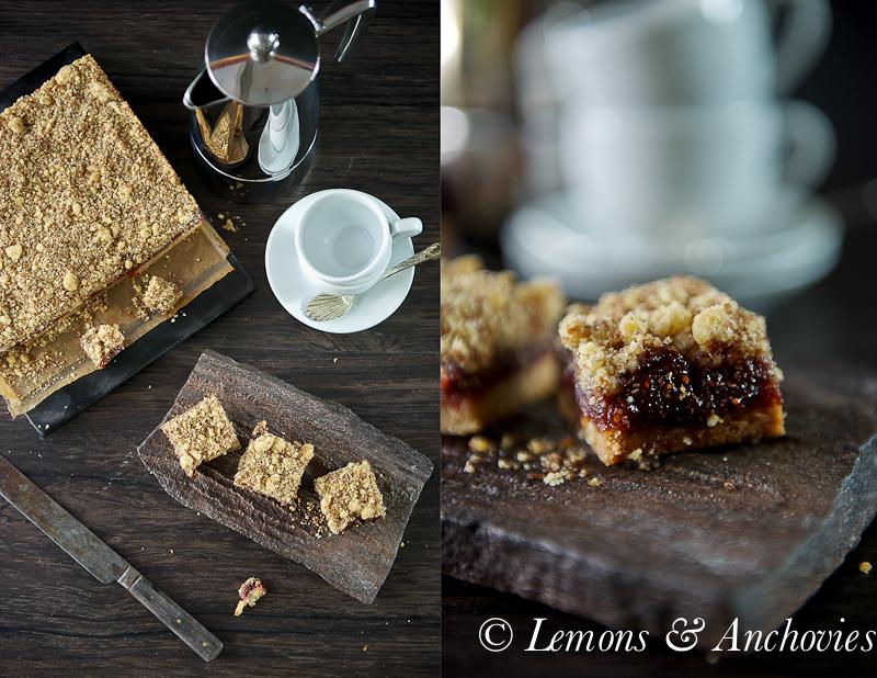 A table setting showing prepared figs and flax seed bars with a cup of tea