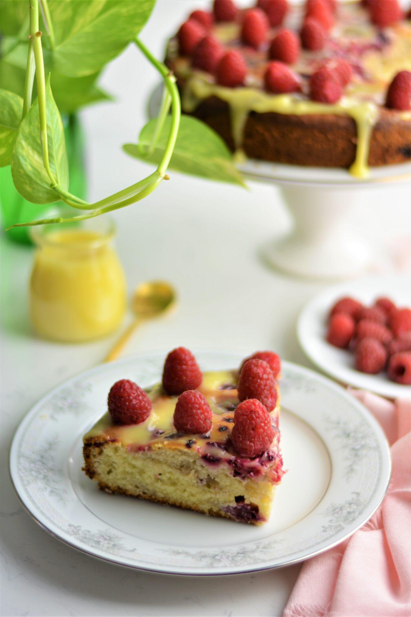 Ingredients for raspberry lemon ricotta cake on a wooden countertop