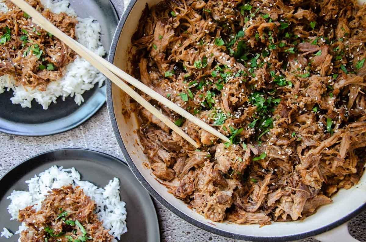 shredded spicy korean pulled pork in a skillet