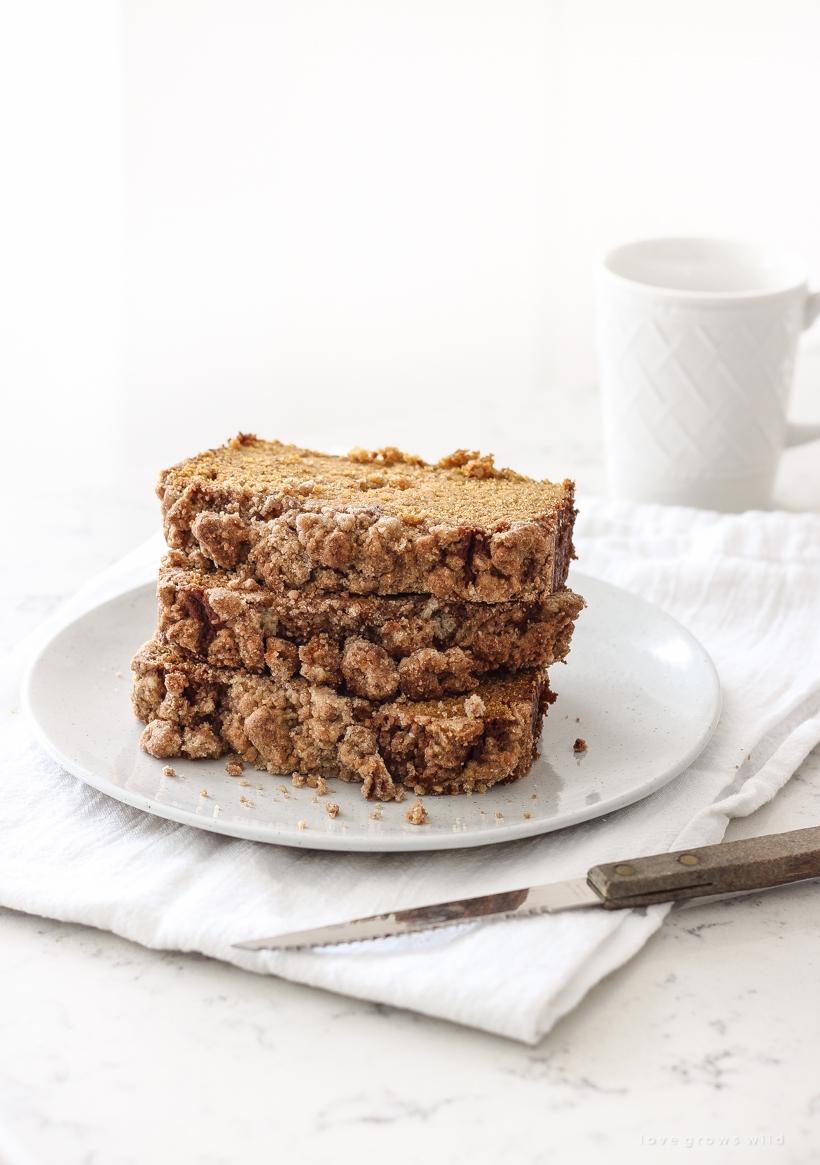 slice of pumpkin streusel bread with a cup of coffee